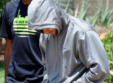 Pistorius leaves the Boschkop police station, east of Pretoria, yesterday afternoon.
