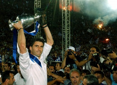 Greece captain Theodoros Zagorakis lifts the Euro 2004 Cup.