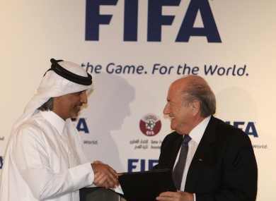 FIFA president Sepp Blatter, right, and Qatar Football Association (QFA) President Sheik Hamad Bin Khalifa Bin Ahmed al-Thani exchange documents (file pic).