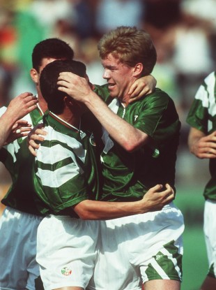 Steve Staunton celebrates with Denis Irwin.