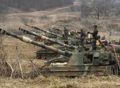 South Korean marines stand on their K-55 self-propelled howitzers during an exercise against possible attacks by North Korea near the border village of Panmunjom.