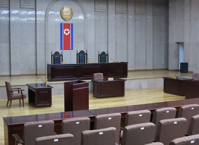 A North Korean flag hangs inside the interior of Pyongyang's Supreme Court.