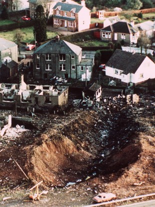 Wrecked houses and a deep gash in the ground in the village of Lockerbie, Scotland - damage caused by the crash of Pan Am Flight 103 Dec. 21, 1988.