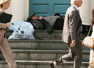 A person asleep in a doorway in Dublin city centre.