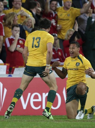 Adam Ashley Cooper and Israel Folau celebrate the winger's first try.