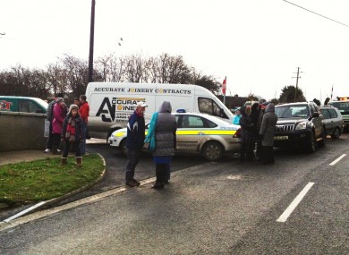 A crowd gatehred at the gate of the school during the stand-off.