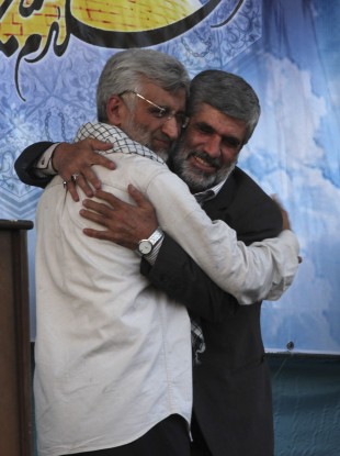 Presidential candidate Saeed Jalili, left, embraces Rahim Ahmadi Roshan, the father of a slain Iranian scientist during a campaign rally.