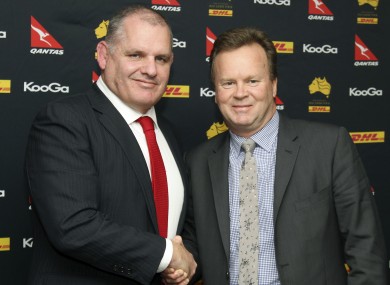 Ewen McKenzie, left, and Australian rugby union CEO Bill Pulver, right, shake on it.