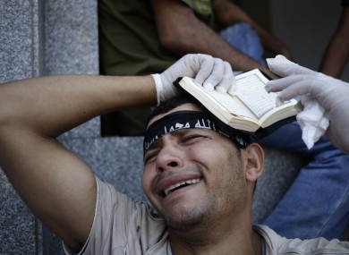 An Egyptian grieves for supporters of Egypt's ousted President Mohammed Morsi.