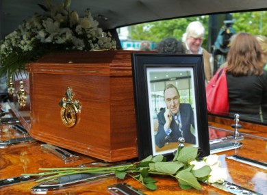 A portrait RTE presenter Colm Murray rests on his coffin at his funeral at St Gabriels Church in Dollymount, Dublin.