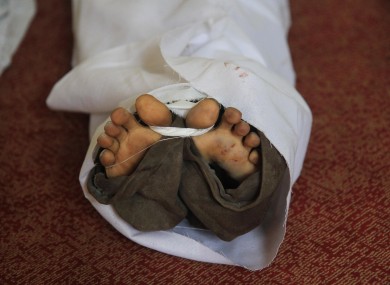 The body of an Egyptian lays in a mosque after the country's bloodiest day in its history