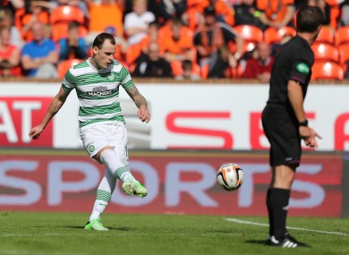 Anthony Stokes sends his free kick curling towards the Dundee United goal.