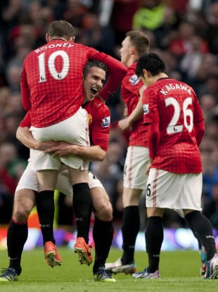 Robin van Persie and Wayne Rooney celebrate at Old Trafford.