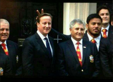 David Cameron gets the 'bunny ears' treatment from Manu Tuilagi.