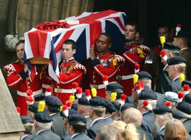 The coffin of murdered Fusilier Lee Rigby is carried from Bury Parish church in Greater Manchester, following his funeral service in July.