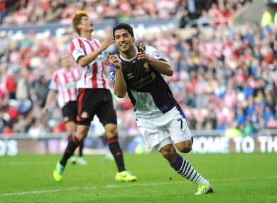 Liverpool's Luis Suarez celebrates scoring his side's third goal of the match.
