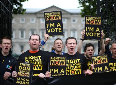 Members of the Union of Students in Ireland protest outside Leinster House to call for the grant to be protected in the upcoming Budget.