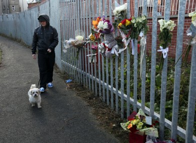 Police use an actor resembling Kevin Kearney along the same winding path through Alexandra Park to the spot where it is believed Mr Kearney was shot dead.
