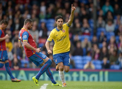 Arsenal's Mikel Arteta celebrates after scoring his team's opening goal from the penalty spot.