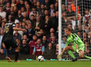 Manchester City's Sergio Aguero scores the first goal of the game.