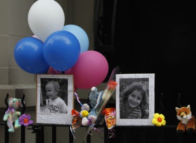 Photographs of Leo and Lucia Krim at a memorial outside the apartment building were they lived in New York.