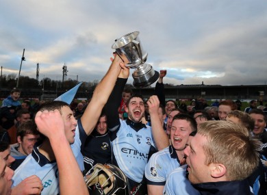 David Breen lifts the cup with his Na Piarsaigh teammates.