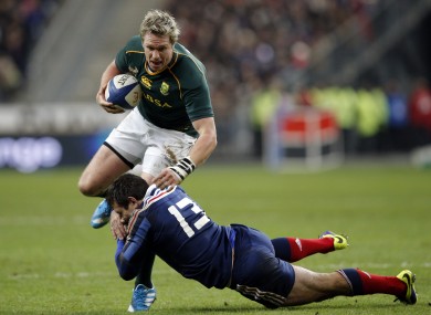 France's Florian Fritz, right, tackles South Africa's Jean de Villiers.