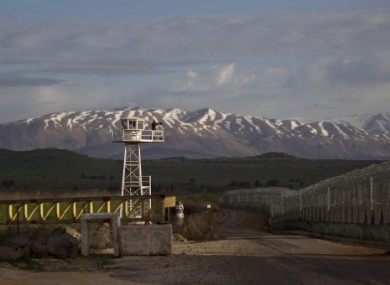 A U.N. peacekeeper at the Quneitra Crossing between Syria and the Israeli-controlled Golan Heights