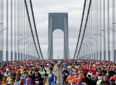 Runners cross the Verrazano-Narrows Bridge at the start of the New York City Marathon on Sunday morning.