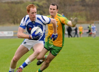 Clancy in action against Neil McGee of Donegal.