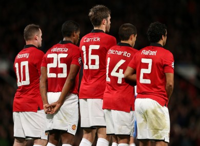 Michael Carrick in the centre of a Manchester United defensive wall.