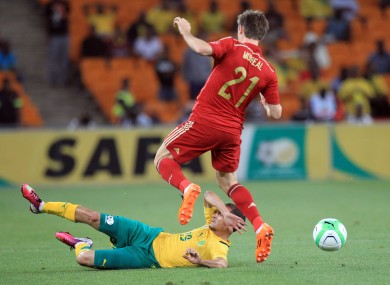 South Africa's Daylon Claasen, bottom, defends against Spain's Ignacio Monreal.
