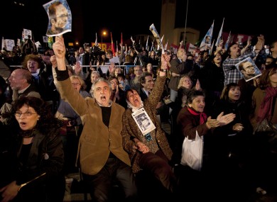 Activists outside a trial against former military and police officials in Buenos Aires, Argentina in 2011. Twelve officials were sentenced to life for crimes against humanity during the country's 1976-83 dictatorship.