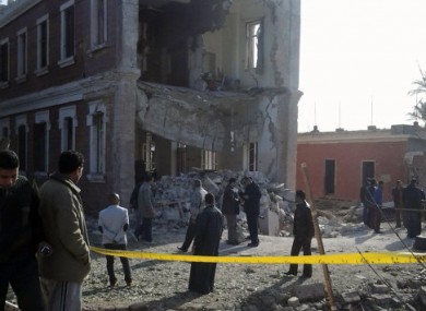 Security personnel at the site of an explosion outside a military intelligence building in Anshas.