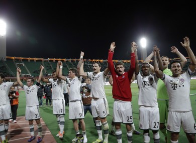 Bayern Munich players celebrates with fans after defeating Guangzhou Evergrande at the Club World Cup soccer tournament in Agadir, Morocco.