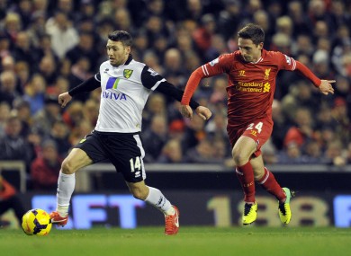 Hoolahan is chased by Liverpool's Joe Allen.