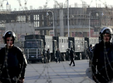 Egyptian security forces stand guard outside a court ahead of the trial of ousted President Mohammed Morsi.