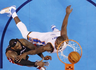 Miami Heat forward LeBron James (6) dunks in front of Oklahoma City Thunder forward Serge Ibaka.