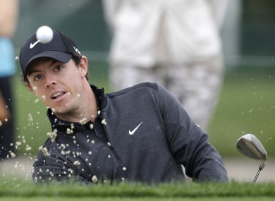 Rory McIlroy hits out of a sand trap on the 13th hole during the second round of the Honda Classic golf tournament.