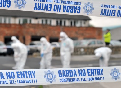 Gardaí at the scene of the shooting at St Dominic's Shopping Centre last year