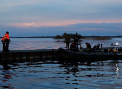 Members of the Civil Defence and a local sub aqua team return to shore as the continuing search of Lough Ree in Co Westmeath.