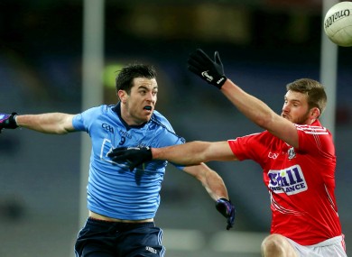 Dublin's Michael Dara Macauley and Cork's Eoin Cadogan.
