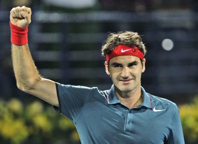 Roger Federer celebrates after he beat Novak Djokovic.