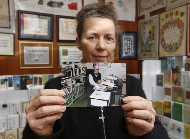 Karen Short, the wife of John Short, with a photograph of her husband.