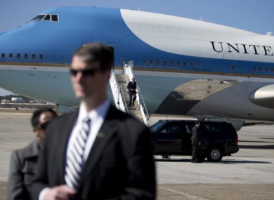 A Secret Service stands guard as President Barack Obama lands in Air Force One.