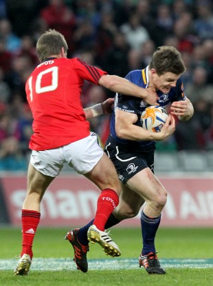Ronan O'Gara and Brian O'Driscoll clash in 2012.