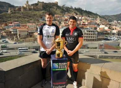 Captains of Romania and Georgia pose with the Webb Ellis trophy.