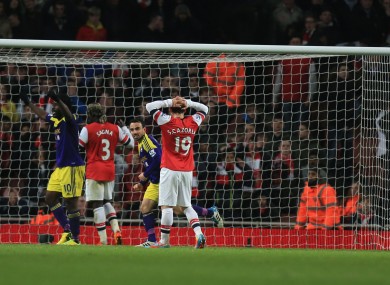 Swansea City's Leon Britton (3rd left) celebrates the equaliser own goal scored by Arsenal's Mathieu Flamini (right).