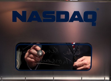 Enda Kenny signs his autograph after ringing the NASDAQ opening bell for the first time in Ireland last year.