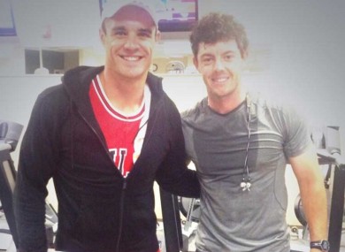 All Blacks star Dan Carter and Rory McIlroy in Augusta yesterday.